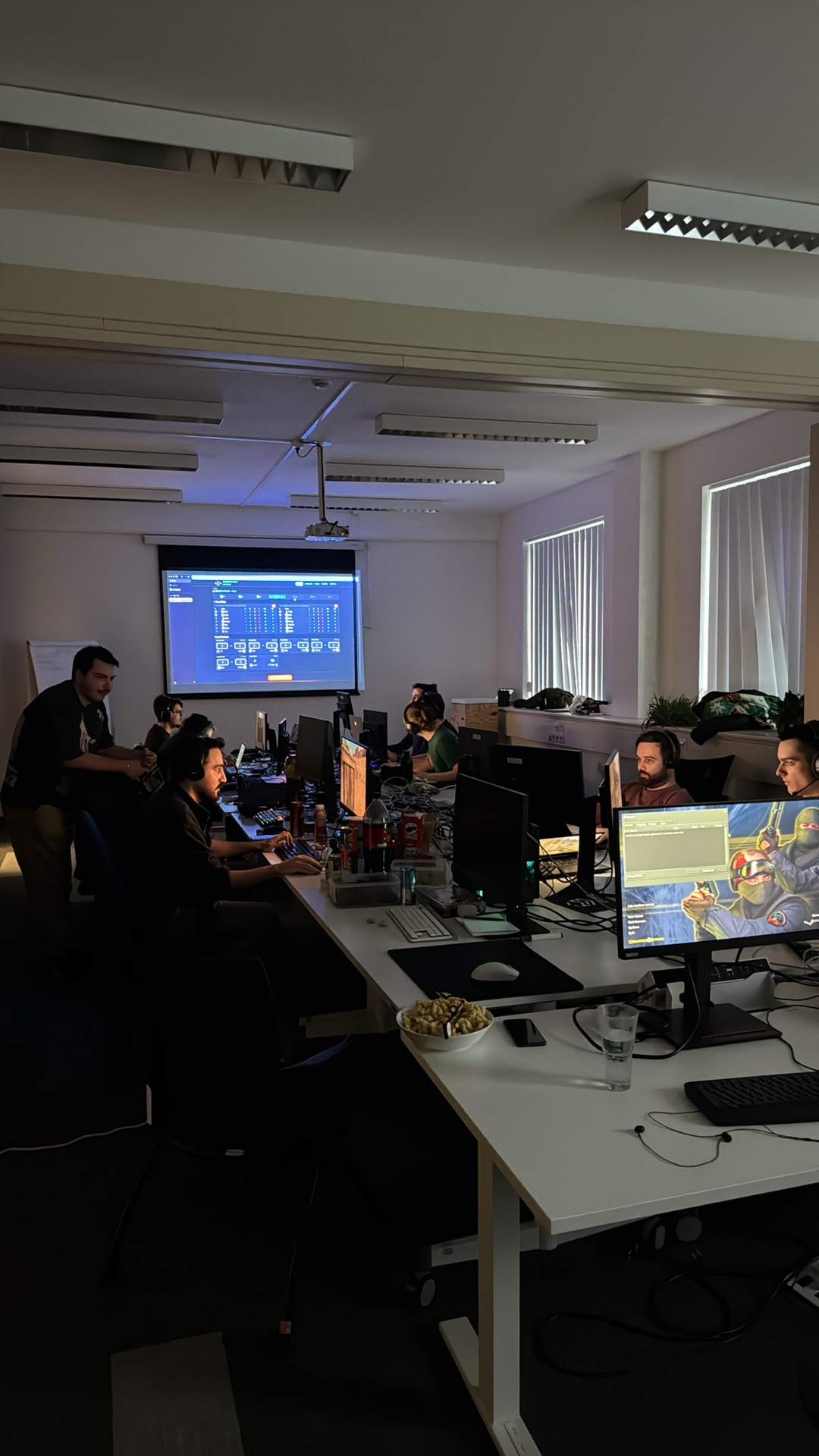Participants gathered around screens during the tournament